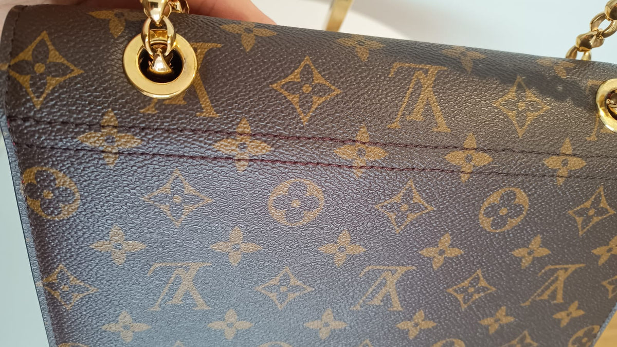 Bolsa Louis Vuitton Victorine Monograma e couro vermelho